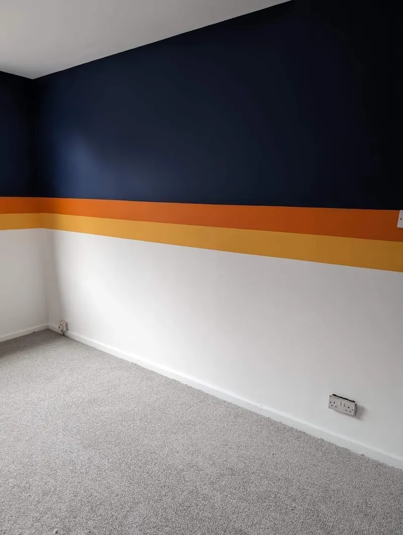 Bold navy and orange striped feature wall