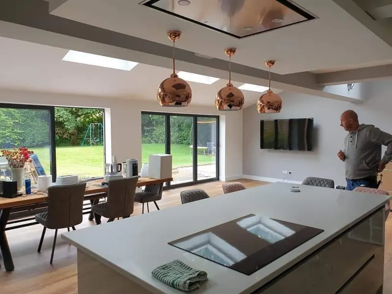 Open-plan kitchen and dining space finished in soft white