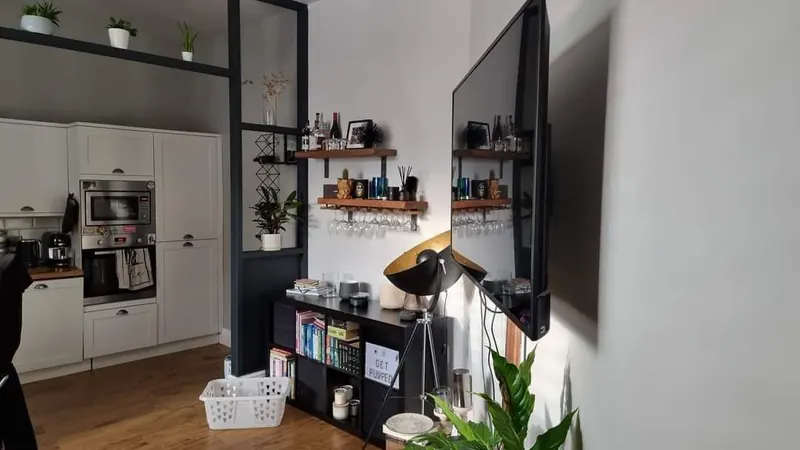 Snug finished in dark navy with styled shelving